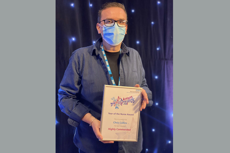 Chris Collins with certificate Chris Collins with certificate