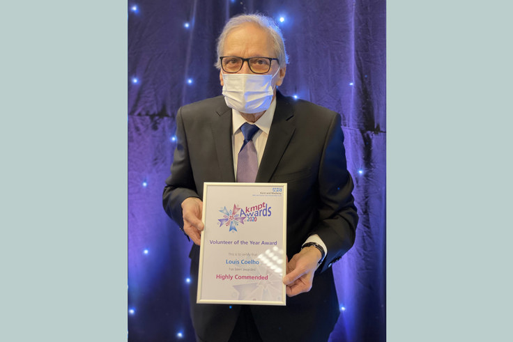 Louis Coello with Volunteer of the year certificate Louis Coello with Volunteer of the year certificate