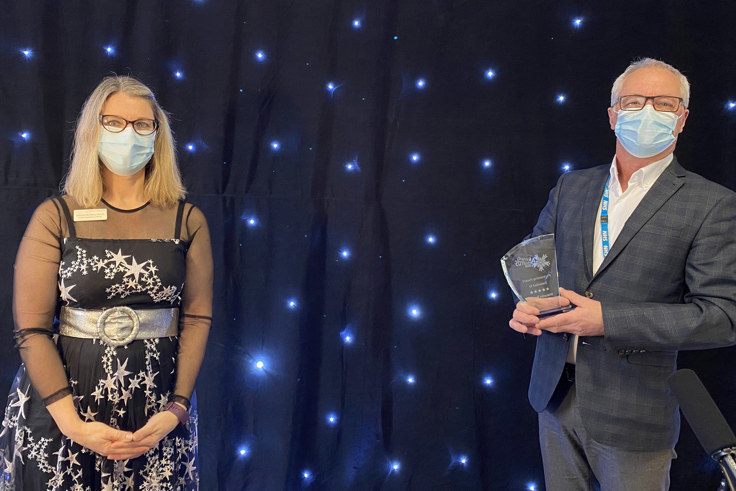 Jacquie and Malcom Brown with award Jacquie and Malcom Brown with award