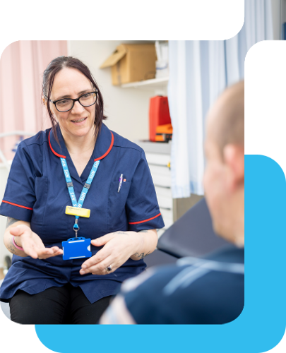 A smiling nhs nurse speaks with a patient